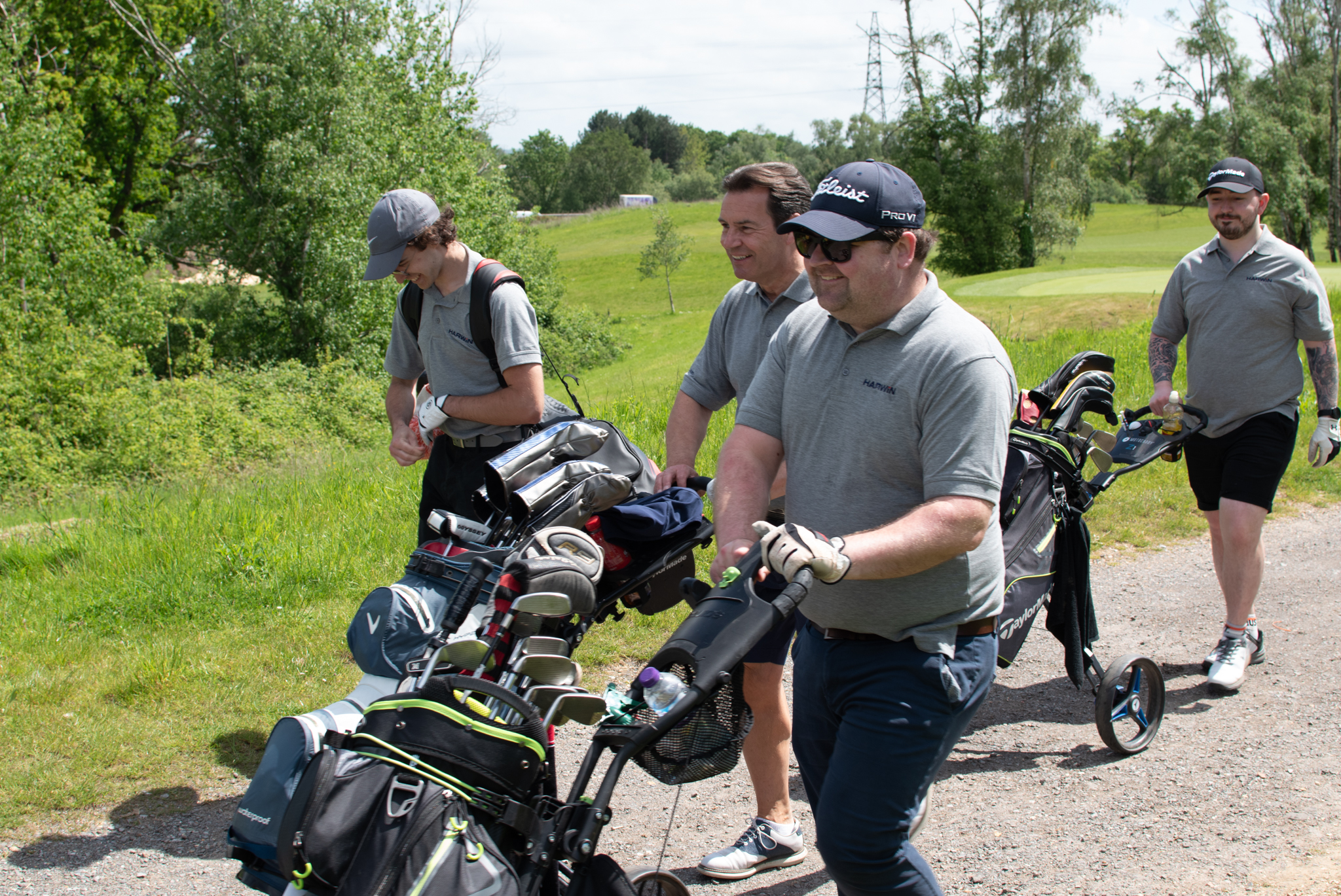 Harwin Golf Team The Harwin Golf Team at the Motiv8 Golf Day pushing their bags